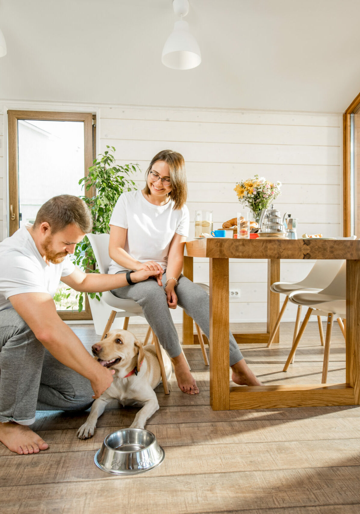Young couple with dog at home | Floor to Ceiling